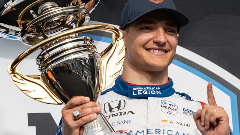 Chip Ganassi Racing driver Alex Palou (10) holds the first place first place trophy Saturday, May 13, 2023, after the GMR Grand Prix at Indianapolis Motor Speedway.
