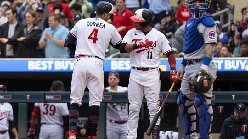 May 13, 2023; Minneapolis, Minnesota, USA; Minnesota Twins shortstop Carlos Correa (4) celebrates with second baseman Jorge Polanco (11) after hitting a solo home run during the seventh inning against the Chicago Cubs at Target Field. Mandatory Credit: Jordan Johnson-USA TODAY Sports