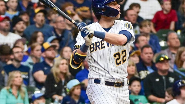 May 13, 2023; Milwaukee, Wisconsin, USA; Milwaukee Brewers left fielder Christian Yelich (22) hits a 2-run home run in the third inning against the Kansas City Royals at American Family Field. Mandatory Credit: Benny Sieu-USA TODAY Sports