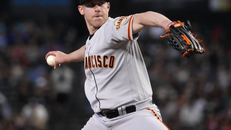 May 13, 2023; Phoenix, Arizona, USA; San Francisco Giants starting pitcher Anthony DeSclafani (26) pitches against the Arizona Diamondbacks during the third inning at Chase Field. Mandatory Credit: Joe Camporeale-USA TODAY Sports