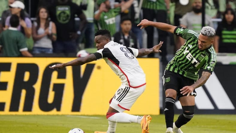 May 13, 2023; Austin, Texas, USA; FC Dallas forward Jader Obrian (8) dribbles the ball past the Austin FC midfielder Daniel Pereira (6) at Q2 Stadium. Mandatory Credit: Scott Wachter-USA TODAY Sports