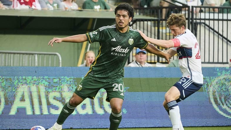 May 13, 2023; Portland, Oregon, USA;  Portland Timbers midfielder Evander (20) controls the ball during the first half against Vancouver Whitecaps midfielder Ryan Gauld (25)at Providence Park. Mandatory Credit: Troy Wayrynen-USA TODAY Sports
