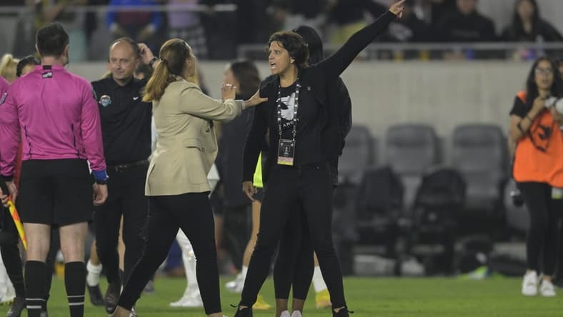May 13, 2023; Los Angeles, California, USA;  Angel City FC president Julie Uhrman (right) is held back by Angel City FC head coach Freya Coombe during the second half at BMO Stadium. Mandatory Credit: Jayne Kamin-Oncea-USA TODAY Sports