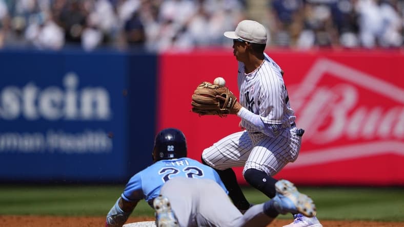 May 14, 2023; Bronx, New York, USA; Tampa Bay Rays center fielder Jose Siri (22) slides safely into second base with a double with New York Yankees second baseman Oswaldo Cabrera (95) receiving the throw during the third inning at Yankee Stadium. Mandatory Credit: Gregory Fisher-USA TODAY Sports