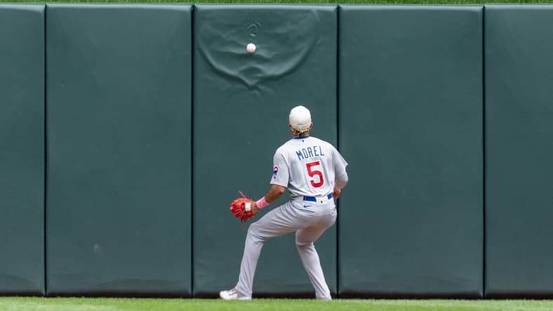May 14, 2023; Minneapolis, Minnesota, USA; Chicago Cubs center fielder Christopher Morel (5) plays a Minnesota Twins second baseman Nick Gordon (1) hit off the wall in the bottom of the third at Target Field. Mandatory Credit: Matt Blewett-USA TODAY Sports