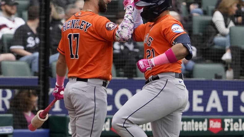 May 14, 2023; Chicago, Illinois, USA; Houston Astros designated hitter Yainer Diaz (21) is greeted by second baseman David Hensley (17) after hitting a home run against the Chicago White Sox during the fourth inning at Guaranteed Rate Field. Mandatory Credit: David Banks-USA TODAY Sports