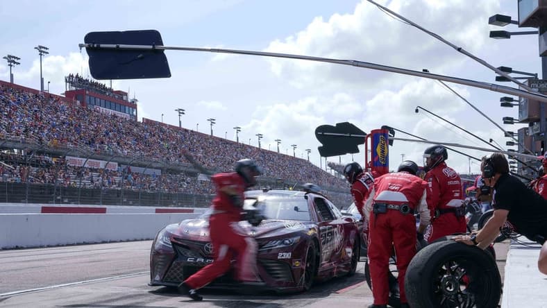 May 14, 2023; Darlington, South Carolina, USA; NASCAR Cup Series driver Bubba Wallace (23) gets service at Darlington Raceway. Mandatory Credit: David Yeazell-USA TODAY Sports