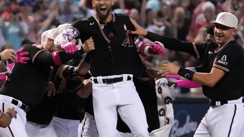 May 14, 2023; Phoenix, Arizona, USA; Arizona Diamondbacks left fielder Lourdes Gurriel Jr. (12) celebrates after hitting a walk off RBI double against the San Francisco Giants during the ninth inning at Chase Field. Mandatory Credit: Joe Camporeale-USA TODAY Sports