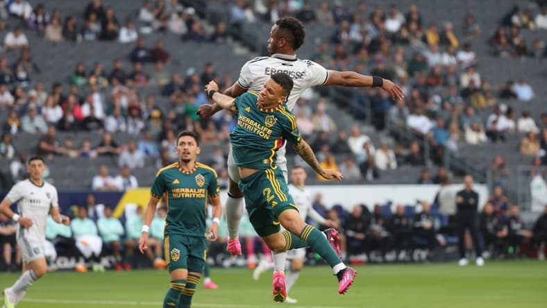 May 14, 2023; Carson, California, USA; San Jose Earthquakes forward Jeremy Ebobisse (11) heads the ball over Los Angeles Galaxy defender Calegari (2) during the first half at Dignity Health Sports Park. Mandatory Credit: Kiyoshi Mio-USA TODAY Sports