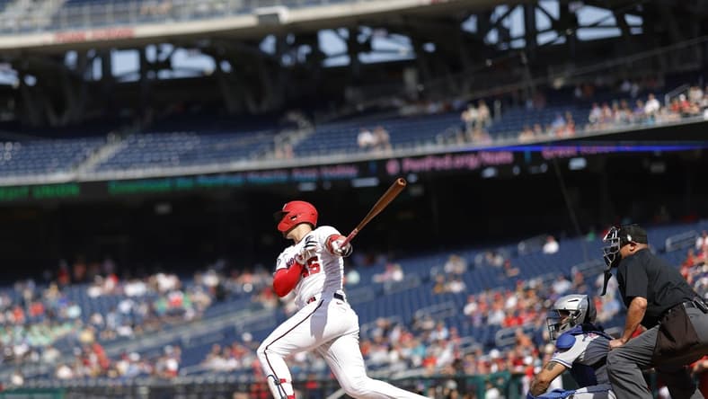 May 15, 2023; Washington, District of Columbia, USA; Washington Nationals designated hitter Joey Meneses (45) hits an RBI double against the New York Mets during the first inning at Nationals Park. Mandatory Credit: Geoff Burke-USA TODAY Sports