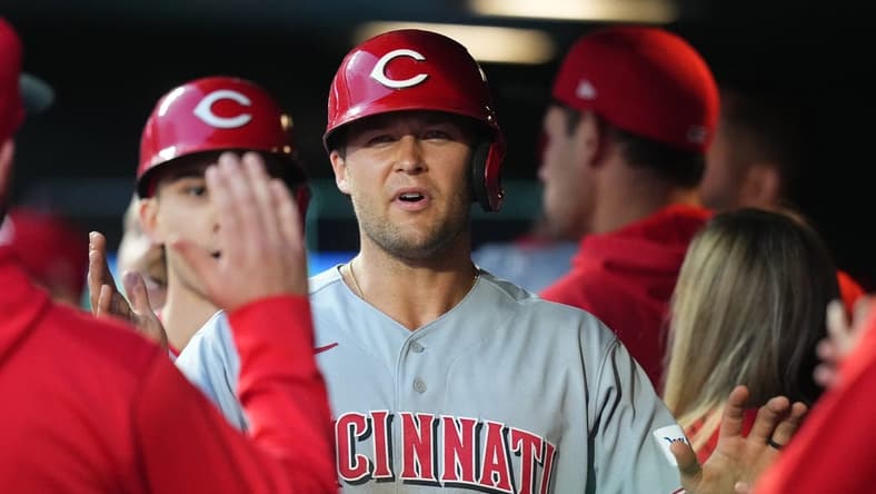 May 15, 2023; Denver, Colorado, USA; Cincinnati Reds center fielder Nick Senzel (15) celebrates scoring a run in the fourth inning against the Colorado Rockies at Coors Field. Mandatory Credit: Ron Chenoy-USA TODAY Sports