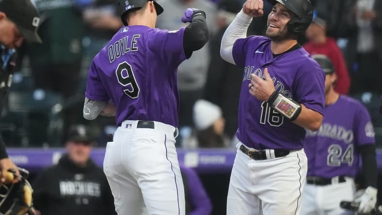 May 15, 2023; Denver, Colorado, USA; Colorado Rockies center fielder Brenton Doyle (9) celebrates his two-run home run with catcher Austin Wynns (16) in the fourth inning against the Cincinnati Reds at Coors Field. Mandatory Credit: Ron Chenoy-USA TODAY Sports