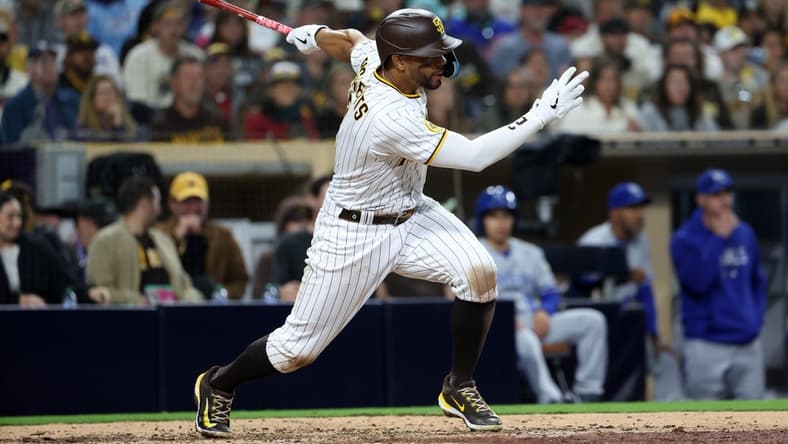 May 15, 2023; San Diego, California, USA; San Diego Padres shortstop Xander Bogaerts (2) hits a single during the seventh inning against the Kansas City Royals at Petco Park. Mandatory Credit: Kiyoshi Mio-USA TODAY Sports