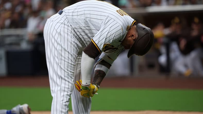 May 15, 2023; San Diego, California, USA; San Diego Padres third baseman Manny Machado (13) reacts after being hit by a pitch during the second inning against the Kansas City Royals at Petco Park. Mandatory Credit: Kiyoshi Mio-USA TODAY Sports