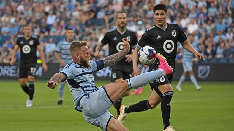 May 13, 2023; Kansas City, Kansas, USA;  Sporting Kansas City forward Johnny Russell (7) makes a play on the ball in the first half against Minnesota United at Children's Mercy Park. Mandatory Credit: Peter Aiken-USA TODAY Sports