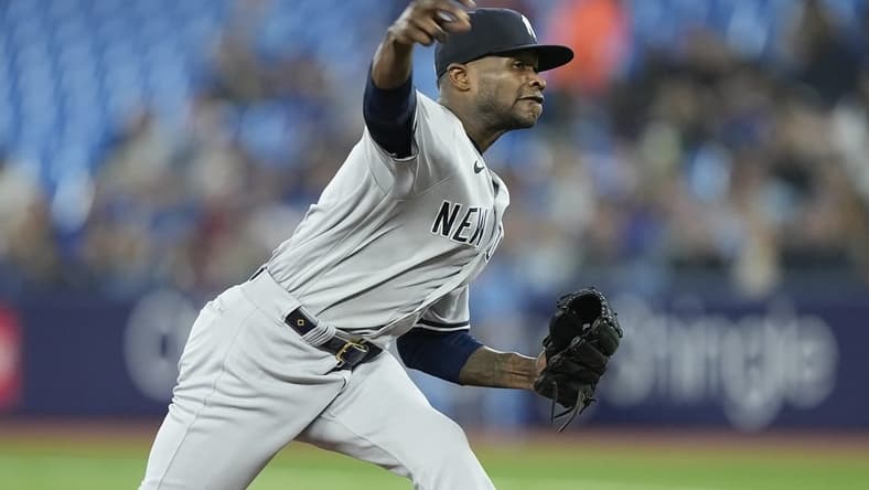 May 16, 2023; Toronto, Ontario, CAN; New York Yankees pitcher Domingo German (0) pitches to the Toronto Blue Jays during the first inning at Rogers Centre. Mandatory Credit: John E. Sokolowski-USA TODAY Sports