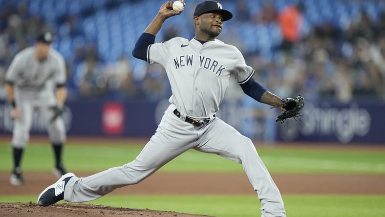 May 16, 2023; Toronto, Ontario, CAN; New York Yankees starting pitcher Domingo German (0) pitches to the Toronto Blue Jays during the first inning at Rogers Centre. Mandatory Credit: John E. Sokolowski-USA TODAY Sports