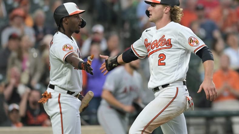 May 16, 2023; Baltimore, Maryland, USA; Baltimore Orioles third baseman Gunnar Henderson (2) celebrates with Baltimore Orioles shortstop Jorge Mateo (3) after scoring during the fourth inning against the Los Angeles Angels at Oriole Park at Camden Yards. Mandatory Credit: Tommy Gilligan-USA TODAY Sports