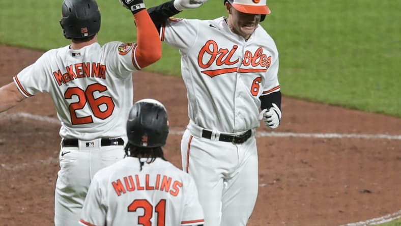 May 16, 2023; Baltimore, Maryland, USA; Baltimore Orioles first baseman Ryan Mountcastle (6) celebrates with left fielder Ryan McKenna (26) after hitting a two run home run against the Los Angeles Angels at Oriole Park at Camden Yards. Mandatory Credit: Tommy Gilligan-USA TODAY Sports