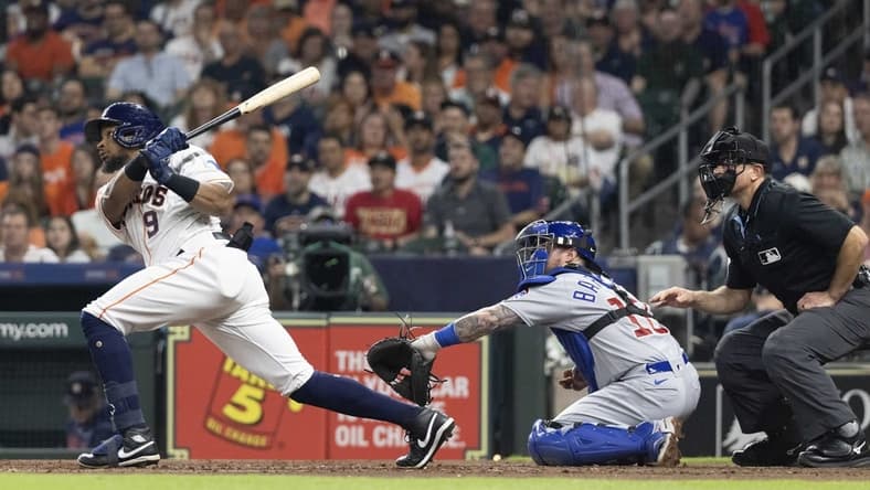 May 16, 2023; Houston, Texas, USA; Houston Astros left fielder Corey Julks (9) hits a double against there Chicago Cubs in the fourth inning at Minute Maid Park. Mandatory Credit: Thomas Shea-USA TODAY Sports