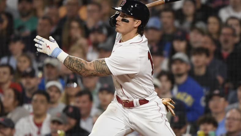 May 16, 2023; Boston, Massachusetts, USA; Boston Red Sox center fielder Jarren Duran (16) hits an RBI single during the seventh inning against the Seattle Mariners at Fenway Park. Mandatory Credit: Bob DeChiara-USA TODAY Sports