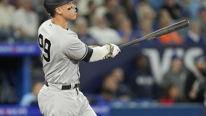 May 16, 2023; Toronto, Ontario, CAN; New York Yankees designated hitter Aaron Judge (99) watches his ball go over the center field wall for a two run home run against the Toronto Blue Jays during the eighth inning at Rogers Centre. Mandatory Credit: John E. Sokolowski-USA TODAY Sports