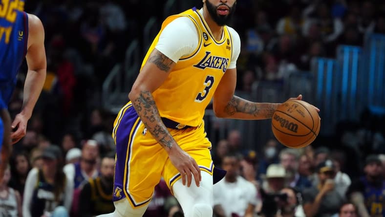 May 16, 2023; Denver, Colorado, USA; Los Angeles Lakers forward Anthony Davis (3) controls the ball against the Denver Nuggets in the third quarter during game one of the Western Conference Finals for the 2023 NBA playoffs at Ball Arena. Mandatory Credit: Ron Chenoy-USA TODAY Sports