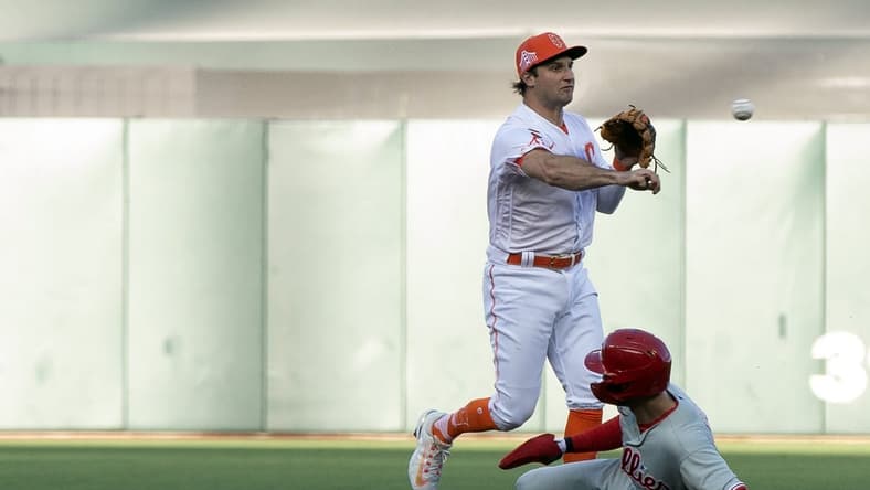 May 16, 2023; San Francisco, California, USA; San Francisco Giants shortstop Casey Schmitt (6) throws over Philadelphia Phillies shortstop Trea Turner (7) to complete a double play during the first inning at Oracle Park. Bryce Harper was out at first. Mandatory Credit: D. Ross Cameron-USA TODAY Sports