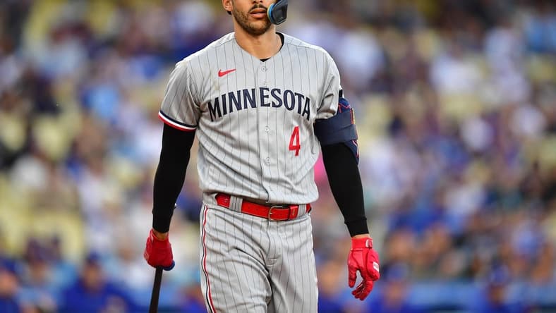 May 16, 2023; Los Angeles, California, USA; Minnesota Twins shortstop Carlos Correa (4) reacts after striking out against the Los Angeles Dodgers during the first inning at Dodger Stadium. Mandatory Credit: Gary A. Vasquez-USA TODAY Sports