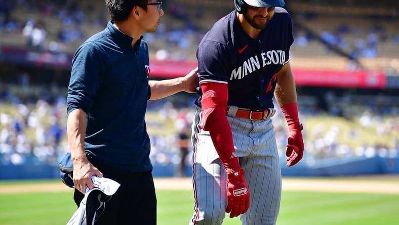May 17, 2023; Los Angeles, California, USA; Minnesota Twins right fielder Joey Gallo (13) leaves after suffering an apparent injury during his at bat against the Los Angeles Dodgers during the ninth inning at Dodger Stadium. Mandatory Credit: Gary A. Vasquez-USA TODAY Sports
