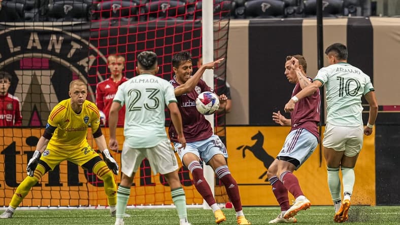 May 17, 2023; Atlanta, Georgia, USA; Colorado Rapids midfielder Danny Leyva (15) is called for a hand foul after blocking a shot by Atlanta United midfielder Luiz Araujo (10) during the first half at Mercedes-Benz Stadium. Mandatory Credit: Dale Zanine-USA TODAY Sports