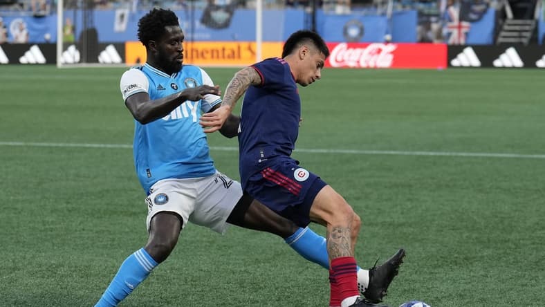 May 17, 2023; Charlotte, North Carolina, USA; Charlotte FC midfielder Derrick Jones (20) and Chicago Fire defender Alonso Aceves (3) vie for the possession during the first half at Bank of America Stadium. Mandatory Credit: Jim Dedmon-USA TODAY Sports