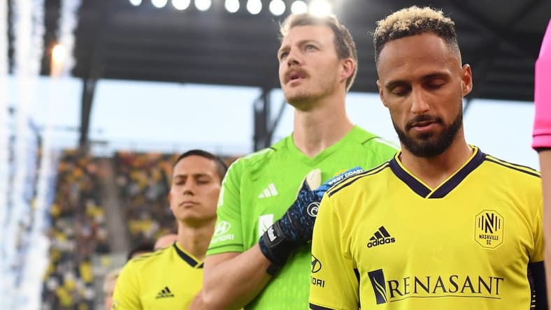 May 17, 2023; Nashville, Tennessee, USA; Nashville SC goalkeeper Joe Willis (1) and Nashville SC midfielder Hany Mukhtar (10) walk out to the pitch for the line up prior to the game at Geodis Park. Mandatory Credit: Christopher Hanewinckel-USA TODAY Sports
