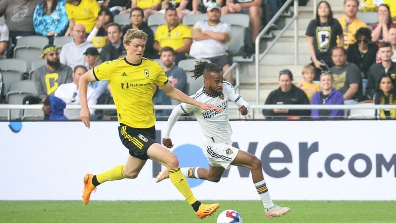 May 17, 2023; Columbus, Ohio, USA; Columbus Crew defender Philip Quinton (2) fight for the ball against Los Angeles Galaxy forward Raheem Edwards (44) during the first half at Lower.com Field. Mandatory Credit: Trevor Ruszkowski-USA TODAY Sports