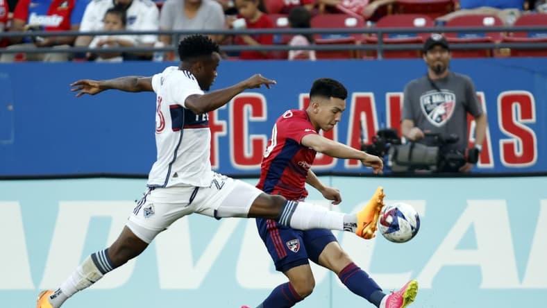 May 17, 2023; Frisco, Texas, USA; Vancouver Whitecaps midfielder Jean-Claude Ngando (26) defends against FC Dallas forward Alan Velasco (20) in the first half at Toyota Stadium. Mandatory Credit: Tim Heitman-USA TODAY Sports