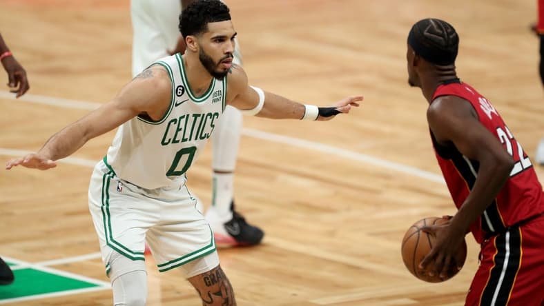 May 17, 2023; Boston, Massachusetts, USA; Boston Celtics forward Jayson Tatum (0) guards Miami Heat forward Jimmy Butler (22) during the second half in game one of the Eastern Conference Finals for the 2023 NBA playoffs at TD Garden. Mandatory Credit: Paul Rutherford-USA TODAY Sports