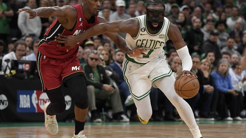 May 17, 2023; Boston, Massachusetts, USA; Boston Celtics guard Jaylen Brown (7) dribbles against Miami Heat forward Jimmy Butler (22) during the second half in game one of the Eastern Conference Finals for the 2023 NBA playoffs at TD Garden. Mandatory Credit: Bob DeChiara-USA TODAY Sports