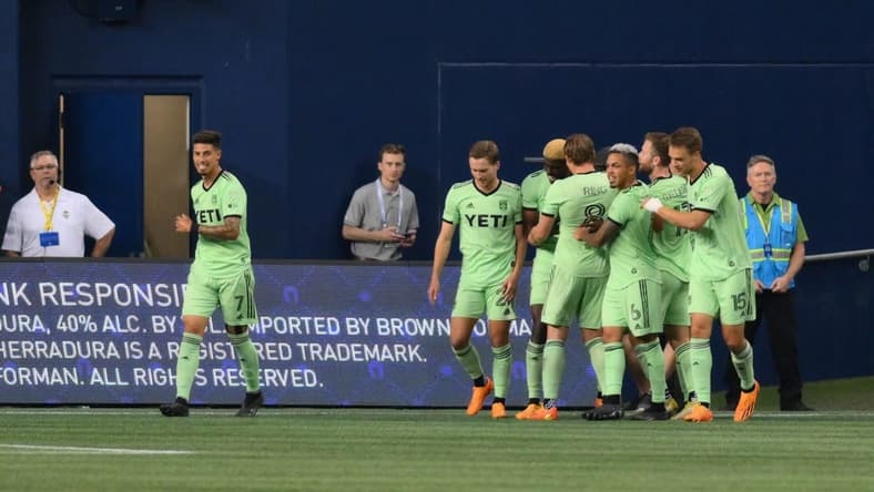 May 17, 2023; Seattle, Washington, USA; The Austin FC celebrate after forward Gyasi Zardes (9) scored a goal against the Seattle Sounders during the second half at Lumen Field. Mandatory Credit: Steven Bisig-USA TODAY Sports