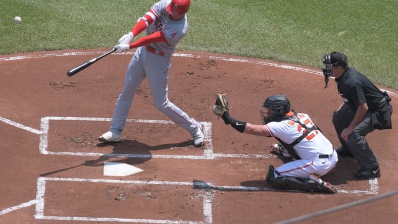 May 18, 2023; Baltimore, Maryland, USA; Los Angeles Angels designated hitter Shohei Ohtani (17) swings through a first inning home run against the Baltimore Orioles at Oriole Park at Camden Yards. Mandatory Credit: Tommy Gilligan-USA TODAY Sports