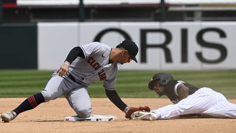 May 18, 2023; Chicago, Illinois, USA; Chicago White Sox shortstop Tim Anderson (7) is caught stealing by Cleveland Guardians second baseman Andres Gimenez (0) during the third inning at Guaranteed Rate Field. Mandatory Credit: Matt Marton-USA TODAY Sports