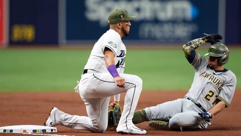 May 19, 2023; St. Petersburg, Florida, USA; Milwaukee Brewers shortstop Willy Adames (27) is tagged out at third base by Tampa Bay Rays third baseman Isaac Paredes (17) in the second inning at Tropicana Field. Mandatory Credit: Nathan Ray Seebeck-USA TODAY Sports