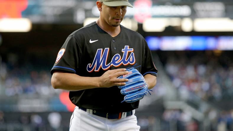 May 19, 2023; New York City, New York, USA; New York Mets starting pitcher Carlos Carrasco (59) reacts as he walks off the field during the first inning against the Cleveland Guardians at Citi Field. Mandatory Credit: Brad Penner-USA TODAY Sports