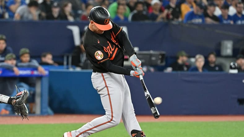 May 19, 2023; Toronto, Ontario, CAN; Baltimore Orioles first baseman Ryan Mountcastle (6) hits a three run home run against the Toronto Blue Jays in the third inning at Rogers Centre. Mandatory Credit: Dan Hamilton-USA TODAY Sports