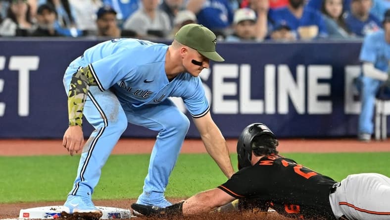 May 19, 2023; Toronto, Ontario, CAN; Toronto Blue Jays third baseman Matt Chapman (26) tags out Baltimore Orioles right fielder Ryan McKenna (26) as he tried to advance from second on an errant pickoff throw in the second inning at Rogers Centre. Mandatory Credit: Dan Hamilton-USA TODAY Sports