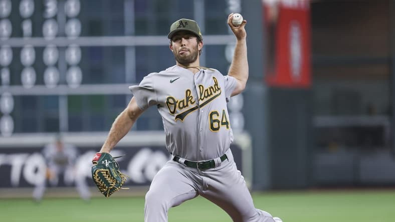 May 19, 2023; Houston, Texas, USA; Oakland Athletics starting pitcher Ken Waldichuk (64) delivers a pitch during the first inning against the Houston Astros at Minute Maid Park. Mandatory Credit: Troy Taormina-USA TODAY Sports