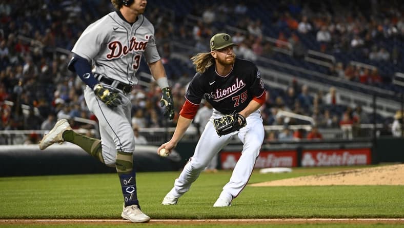 May 19, 2023; Washington, District of Columbia, USA; Washington Nationals relief pitcher Hobie Harris (75) throws out Detroit Tigers third baseman Zach McKinstry (39) during the fifth inning at Nationals Park. Mandatory Credit: Brad Mills-USA TODAY Sports