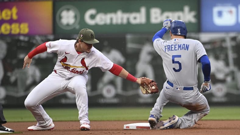 May 19, 2023; St. Louis, Missouri, USA; Los Angeles Dodgers first baseman Freddie Freeman (5) is safe at second base ahead of the tag from St. Louis Cardinals second baseman Nolan Gorman (16) in the first inning at Busch Stadium. Mandatory Credit: Joe Puetz-USA TODAY Sports