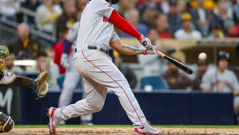 May 19, 2023; San Diego, California, USA; Boston Red Sox third baseman Rafael Devers (11) hits a three run home run (2) in the third inning against the San Diego Padres at Petco Park. Mandatory Credit: David Frerker-USA TODAY Sports