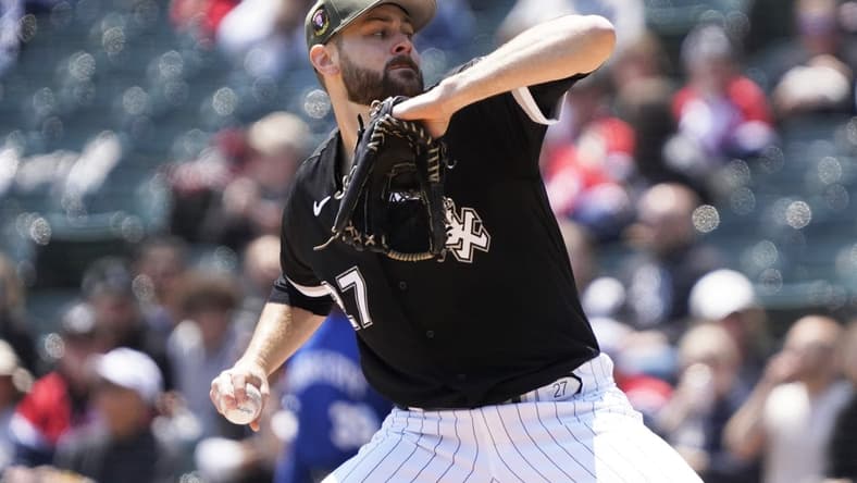 May 20, 2023; Chicago, Illinois, USA; Chicago White Sox starting pitcher Lucas Giolito (27) throws the ball against the Kansas City Royals during the first inning at Guaranteed Rate Field. Mandatory Credit: David Banks-USA TODAY Sports