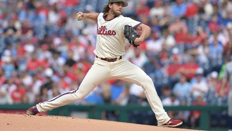 May 20, 2023; Philadelphia, Pennsylvania, USA; Philadelphia Phillies starting pitcher Aaron Nola (27) pitches in the first inning of the game against the Chicago Cubs at Citizens Bank Park. Mandatory Credit: John Geliebter-USA TODAY Sports